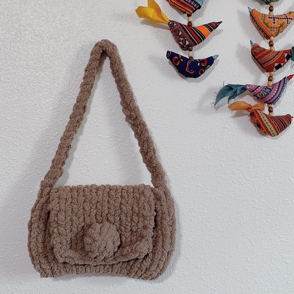 Hand-knitted soft purse with strap and snap closure